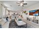 Spacious living area offering an open-concept layout with a kitchen, dining, and living space at 22570 N Lynn St, Maricopa, AZ 85138