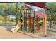 Community playground featuring a small slide, climbing structure, and shade canopy at 22570 N Lynn St, Maricopa, AZ 85138