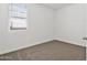 Neutral bedroom with new carpet, bright natural light, and crisp, white walls at 22610 N Lynn St, Maricopa, AZ 85138