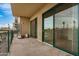 Large balcony featuring sliding glass doors, outdoor furniture, and city views at 2302 N Central Ave # 206, Phoenix, AZ 85004