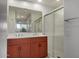 Bathroom featuring double sinks, vanity, and glass-enclosed shower stall at 2302 N Central Ave # 206, Phoenix, AZ 85004
