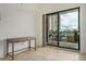 Bright bedroom boasts a sliding door opening to a balcony at 2302 N Central Ave # 206, Phoenix, AZ 85004