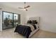 Bedroom featuring a ceiling fan and sliding glass doors to a balcony at 2302 N Central Ave # 206, Phoenix, AZ 85004