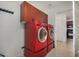 Laundry room equipped with red washer and dryer set at 2302 N Central Ave # 206, Phoenix, AZ 85004