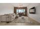 Living room featuring stylish decor, a modern ceiling fan, and a brick fireplace creating a warm ambiance at 2302 N Central Ave # 206, Phoenix, AZ 85004