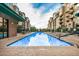 Community pool with many lounge chairs for relaxation at 2302 N Central Ave # 206, Phoenix, AZ 85004