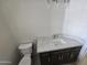 Bathroom featuring a toilet and vanity with marbled countertop and dark wood cabinets at 24183 N 196Th Ln, Surprise, AZ 85387