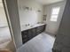 Bathroom featuring double sinks with granite counters, and a tiled shower and tub combination at 24183 N 196Th Ln, Surprise, AZ 85387