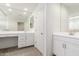 Elegant primary bathroom with double sink vanity, make up vanity and bright lighting at 24733 N 96Th Ln, Peoria, AZ 85383