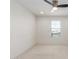 Bright bedroom with neutral carpet, a ceiling fan and natural light from the window at 24733 N 96Th Ln, Peoria, AZ 85383