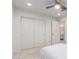 This bedroom features soft carpet, a ceiling fan and a convenient closet for storage at 24733 N 96Th Ln, Peoria, AZ 85383