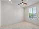 Spacious carpeted bedroom featuring natural light and plenty of space to relax at 24733 N 96Th Ln, Peoria, AZ 85383