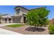 Charming two-story home boasts a well-manicured lawn, complemented by a two-car garage and inviting curb appeal at 24733 N 96Th Ln, Peoria, AZ 85383