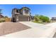 Charming two-story home boasts a well-manicured lawn, complemented by a two-car garage and inviting curb appeal at 24733 N 96Th Ln, Peoria, AZ 85383