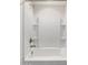 Close-up of a shower over tub with a rainfall shower head and niche storage at 24733 N 96Th Ln, Peoria, AZ 85383
