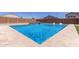 Beautiful pool features a water feature and tanning ledge with lounge chairs at 24733 N 96Th Ln, Peoria, AZ 85383