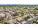 Overhead view of neighborhood showcasing home exteriors, desert landscaping, and mountain backdrop at 26633 N 41St Way, Cave Creek, AZ 85331