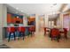 Open dining and kitchen area with breakfast bar seating and rustic table at 26633 N 41St Way, Cave Creek, AZ 85331