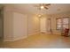 Spacious living room with neutral walls, tile floors, ceiling fan, and bright windows at 26633 N 41St Way, Cave Creek, AZ 85331
