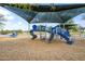 Shaded community playground featuring blue and gray play structures and wood chip ground cover at 26633 N 41St Way, Cave Creek, AZ 85331