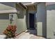 Inviting front entrance with a secure door and lush landscaping at 30031 N Little Leaf Dr, San Tan Valley, AZ 85143