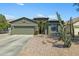 Charming single-story home featuring desert landscaping and a spacious two-car garage at 30031 N Little Leaf Dr, San Tan Valley, AZ 85143