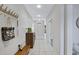 Bright hallway with tile floors, coat rack, and ample storage space at 30031 N Little Leaf Dr, San Tan Valley, AZ 85143