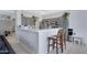Kitchen featuring an island with seating, stainless appliances and view to dining room at 30031 N Little Leaf Dr, San Tan Valley, AZ 85143
