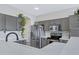 Well-equipped kitchen with stainless steel appliances, gray cabinets, and modern countertops at 30031 N Little Leaf Dr, San Tan Valley, AZ 85143