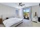 Comfortable main bedroom boasts a ceiling fan and sliding glass door at 30031 N Little Leaf Dr, San Tan Valley, AZ 85143