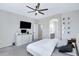 Spacious main bedroom features a ceiling fan and access to bathroom at 30031 N Little Leaf Dr, San Tan Valley, AZ 85143