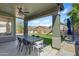 Comfortable covered outdoor patio dining area overlooking the backyard at 30031 N Little Leaf Dr, San Tan Valley, AZ 85143