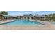 Community pool with sundeck and lounge chairs is a perfect spot for relaxation and recreation at 30031 N Little Leaf Dr, San Tan Valley, AZ 85143