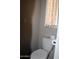 Clean bathroom with a white toilet and neutral paint at 303 S Recker Rd # 247, Mesa, AZ 85206