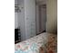 Bedroom with closet and storage, featuring a cozy sea-themed quilt at 303 S Recker Rd # 247, Mesa, AZ 85206