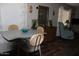 Inviting dining area featuring a table with chairs and a wooden dresser with a mirror at 303 S Recker Rd # 247, Mesa, AZ 85206
