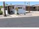 Well-maintained manufactured home with desert landscaping and covered parking at 303 S Recker Rd # 247, Mesa, AZ 85206