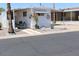 Desirable home featuring a covered carport and a desert landscaped front yard at 303 S Recker Rd # 247, Mesa, AZ 85206