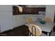 Clean kitchen with white appliances and a dining area at 303 S Recker Rd # 247, Mesa, AZ 85206