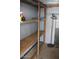 Large storage space with wooden shelving and ample room for organizing belongings at 303 S Recker Rd # 247, Mesa, AZ 85206