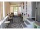 Enclosed sun room is furnished with natural paint and light fixtures at 303 S Recker Rd # 247, Mesa, AZ 85206
