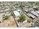Drone shot captures a house with a pool, detached garage and a large, fenced lot at 3043 E Hartford Ave, Phoenix, AZ 85032