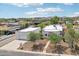An aerial view shows the property with lush trees and landscaping, surrounded by neighborhood homes at 3043 E Hartford Ave, Phoenix, AZ 85032