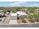 Aerial view of the property with a garage, landscaping, and stunning views of the surrounding area at 3043 E Hartford Ave, Phoenix, AZ 85032