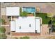Overhead image displays a modern home with a backyard pool, pergola, turf and detached garage at 3043 E Hartford Ave, Phoenix, AZ 85032