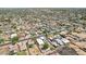 An aerial view of the neighborhood highlighting the home, its pool and proximity to neighborhood amenities at 3043 E Hartford Ave, Phoenix, AZ 85032