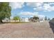 Expansive backyard with desert landscaping, modern home exterior, and inviting outdoor spaces at 3043 E Hartford Ave, Phoenix, AZ 85032