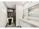 Modern bathroom with a marble vanity and a black toilet at 3043 E Hartford Ave, Phoenix, AZ 85032