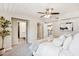Bright bedroom featuring white bedding, and an ensuite bathroom at 3043 E Hartford Ave, Phoenix, AZ 85032