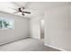 Bright bedroom with carpet flooring and well-lit window at 3043 E Hartford Ave, Phoenix, AZ 85032